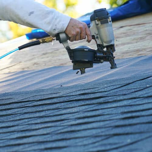 Roofer repairs leak.