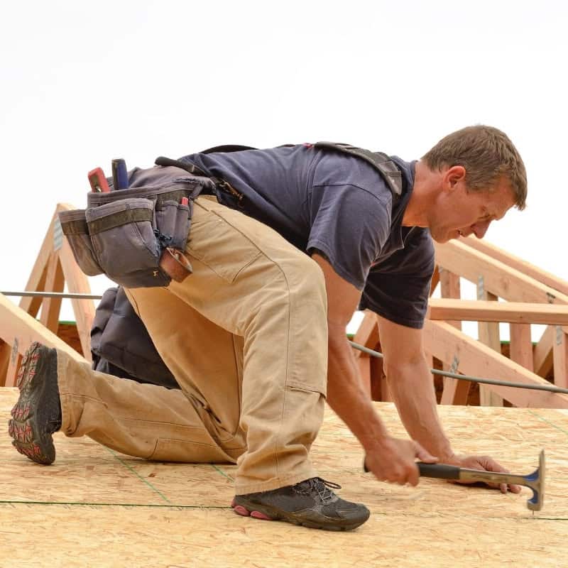 Roofer installs roof