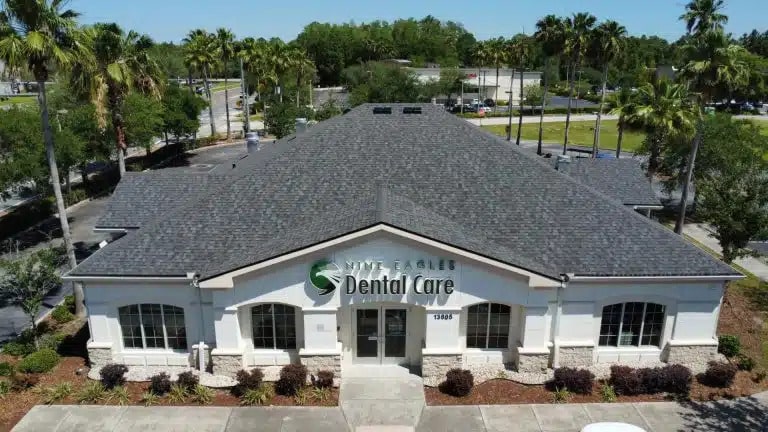 Commercial roofer consults dental office.