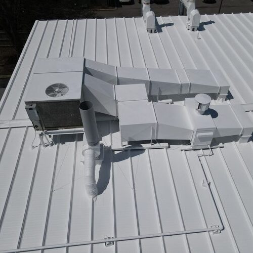 Roof coating applied to metal roof.