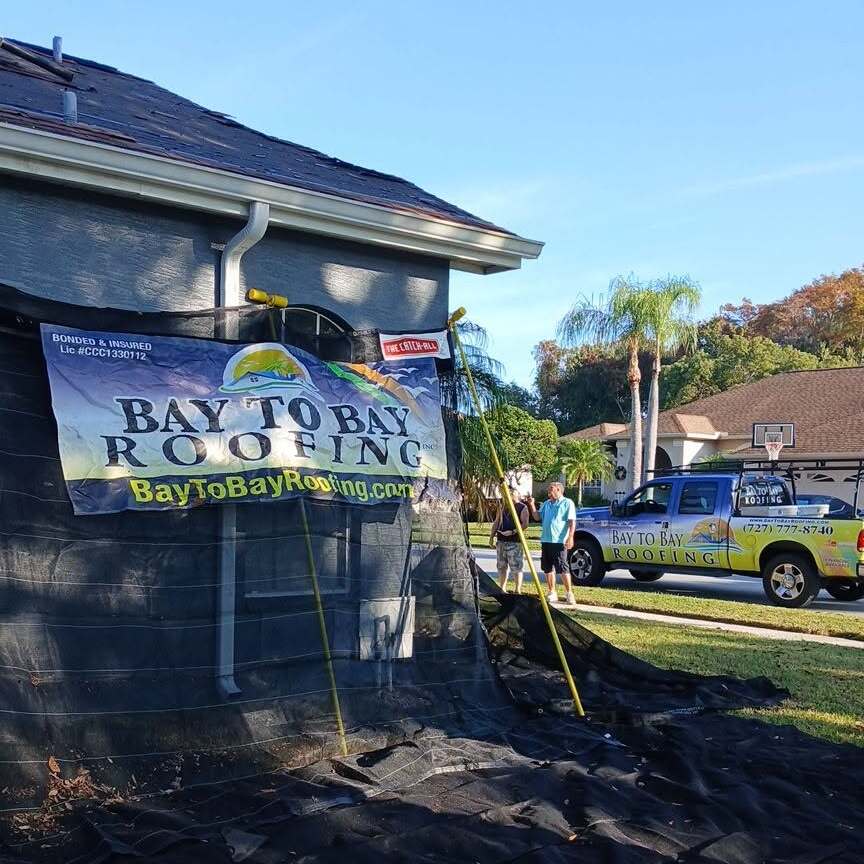 Roofer at work on roof replacement.